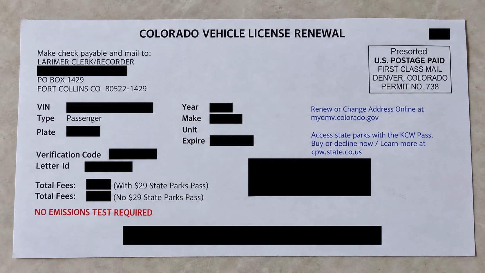 Colorado vehicle registration renewal notice showing the county payment and mailing instructions, with identifying details covered
