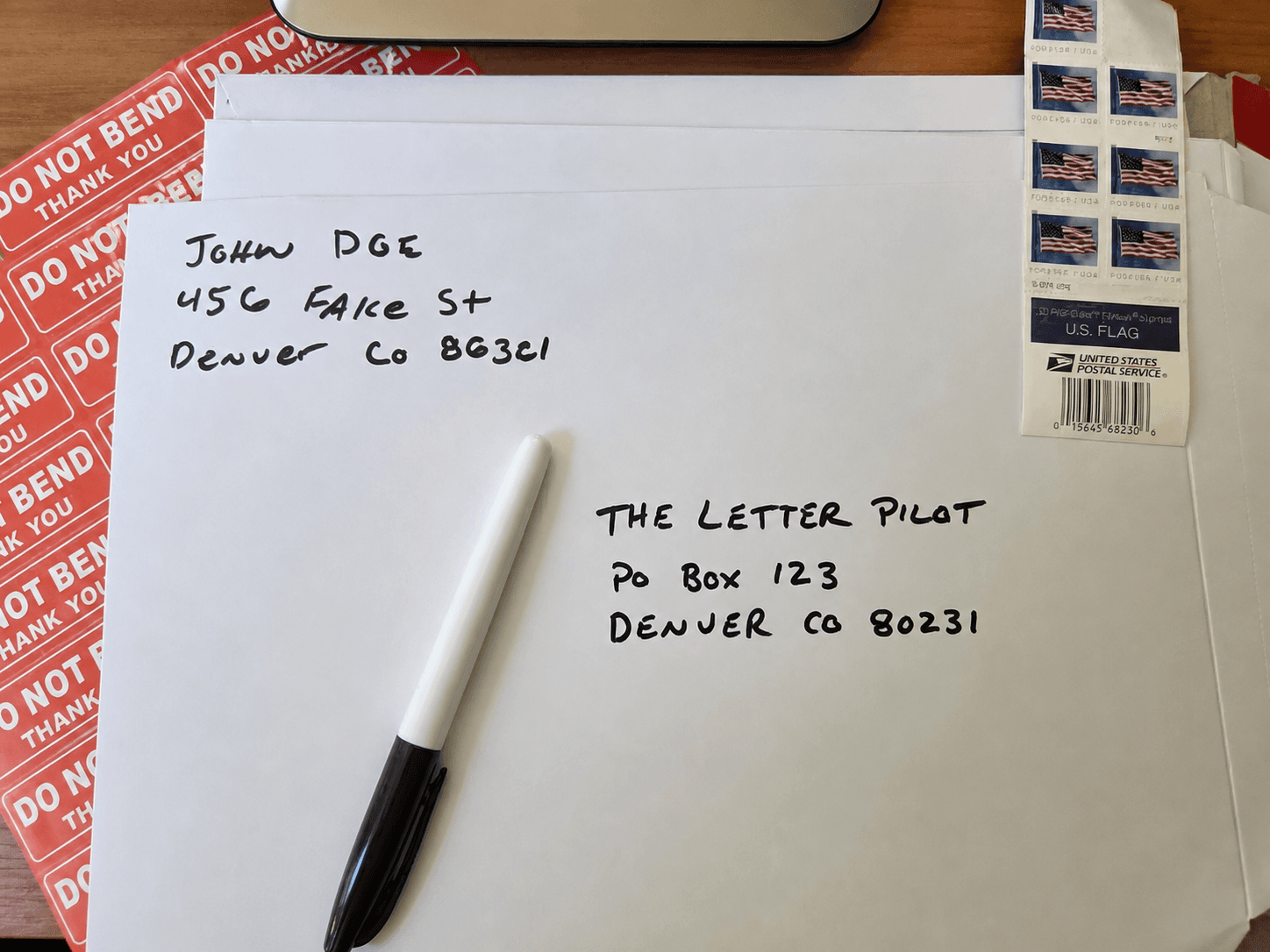 Handwritten example of a PO Box address on an envelope