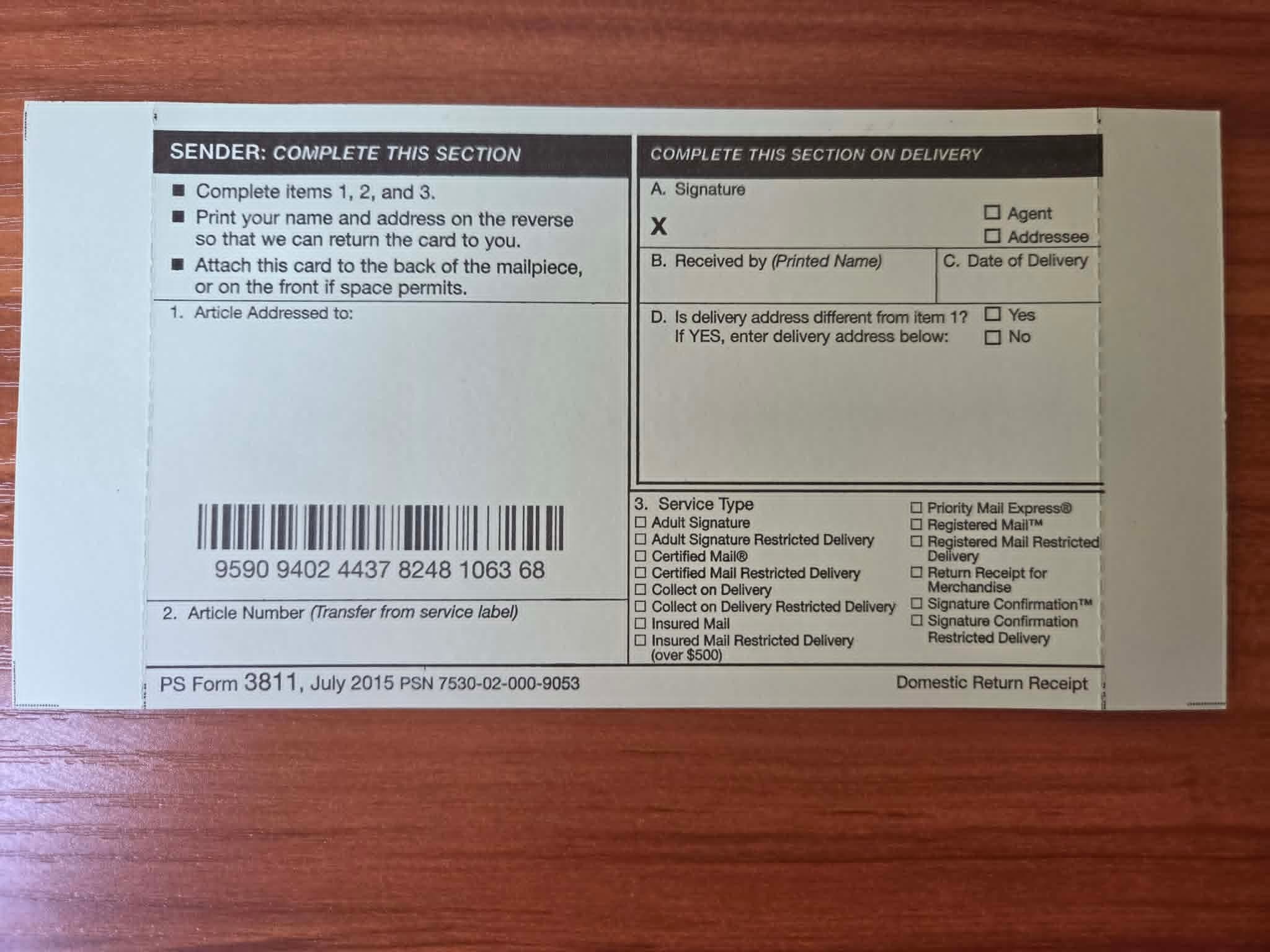 PS Form 3811 domestic return receipt showing the article number transferred from the service label