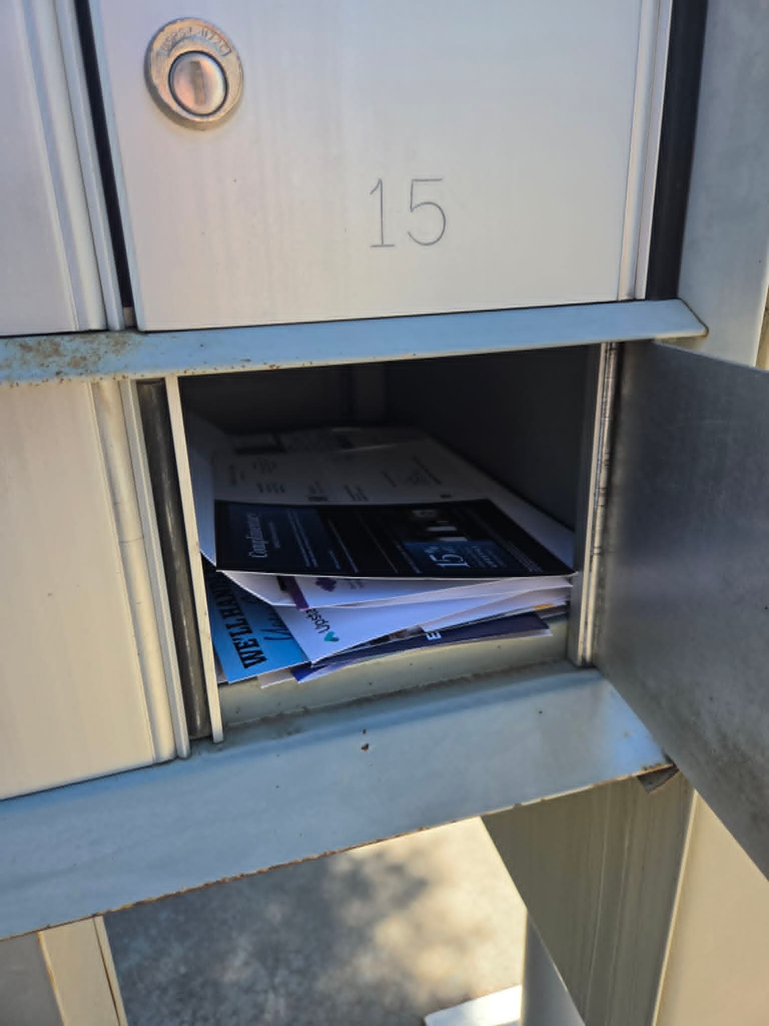 Open mailbox filled with letters for the current and former residents