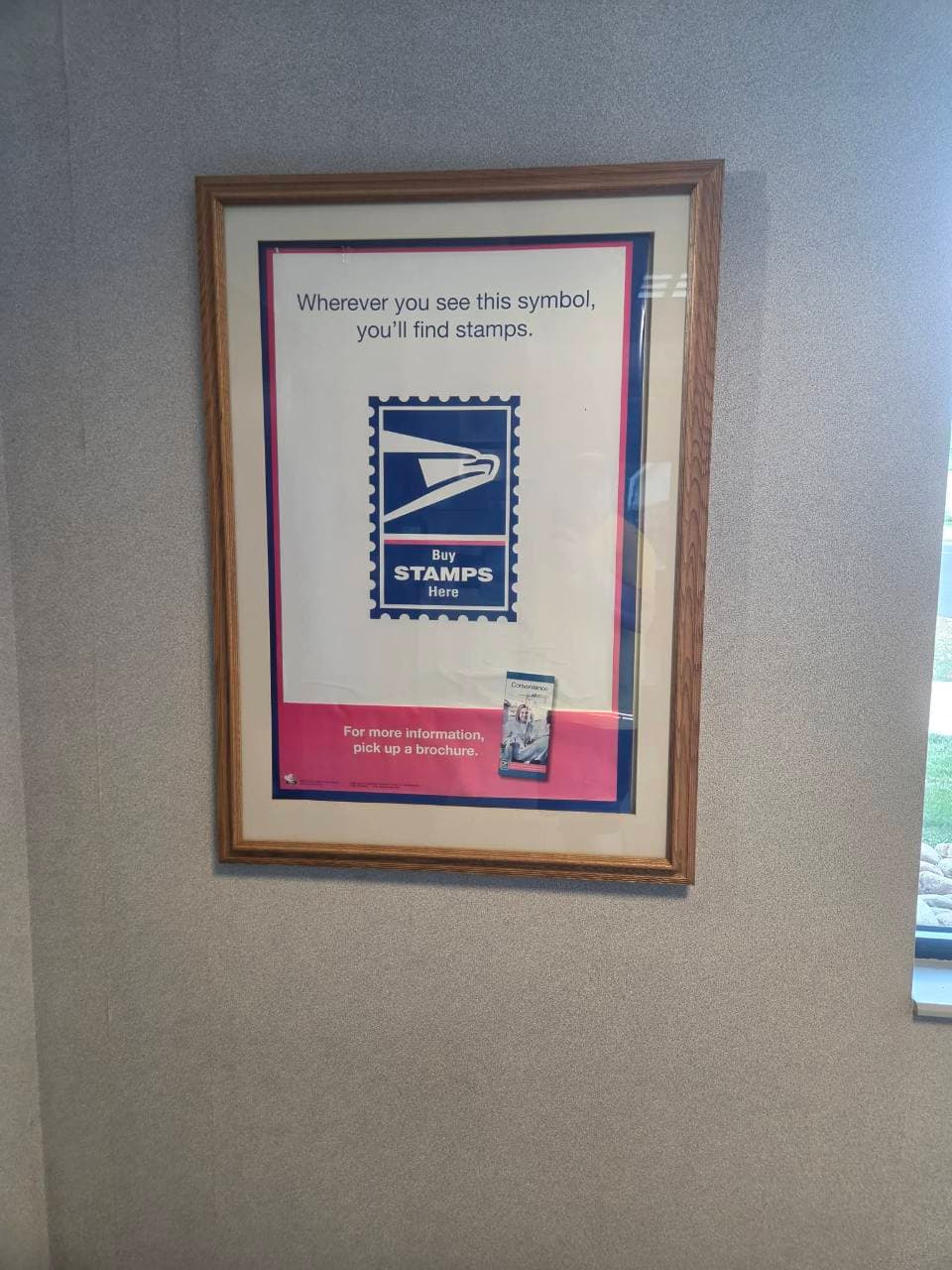 Framed USPS poster with the Buy Stamps Here symbol