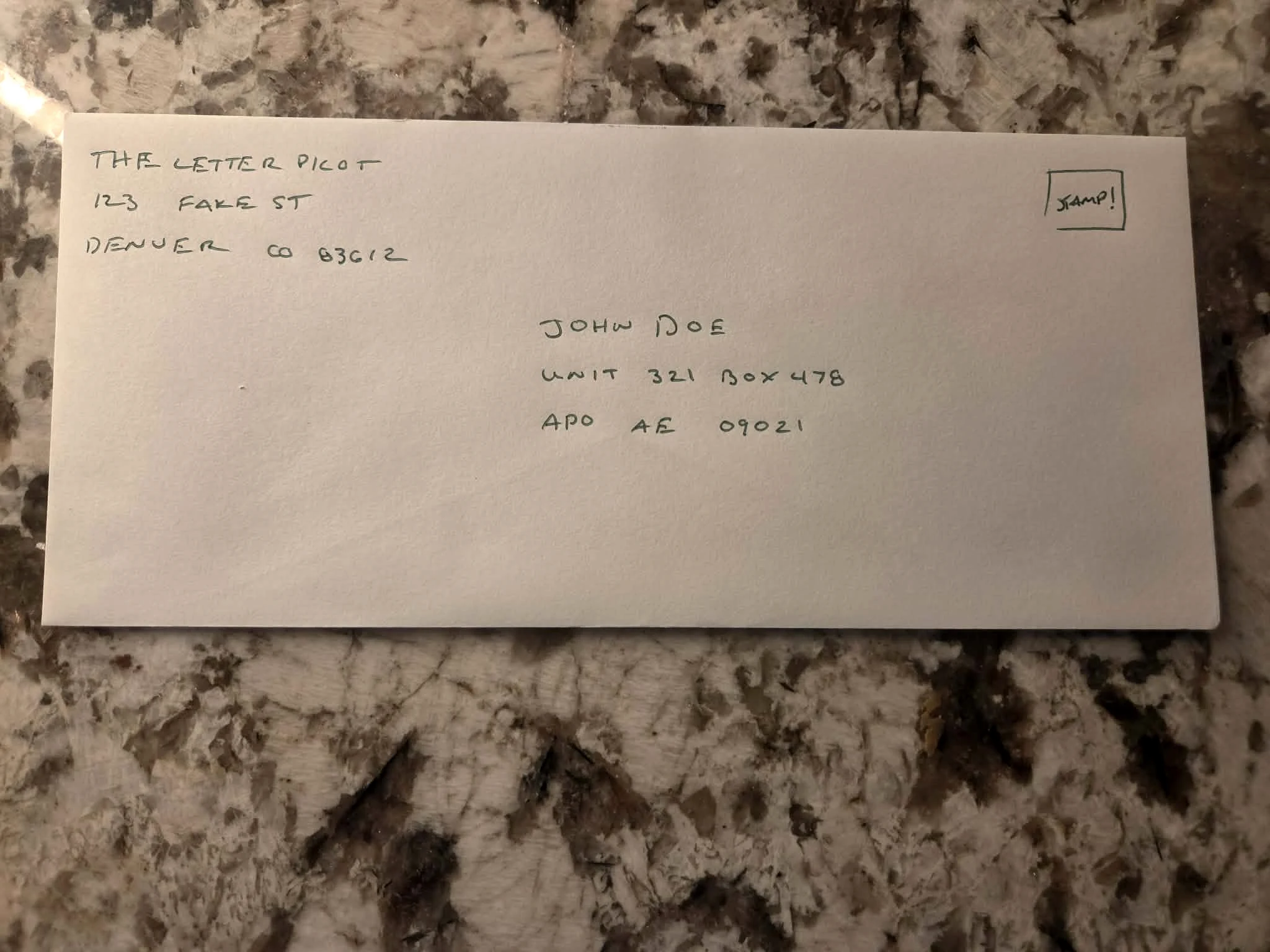Handwritten APO military mailing address on an envelope